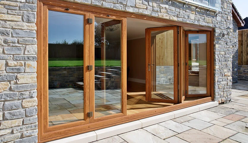 Why Homeowners Are Switching to Timber Bifold Doors in the UK